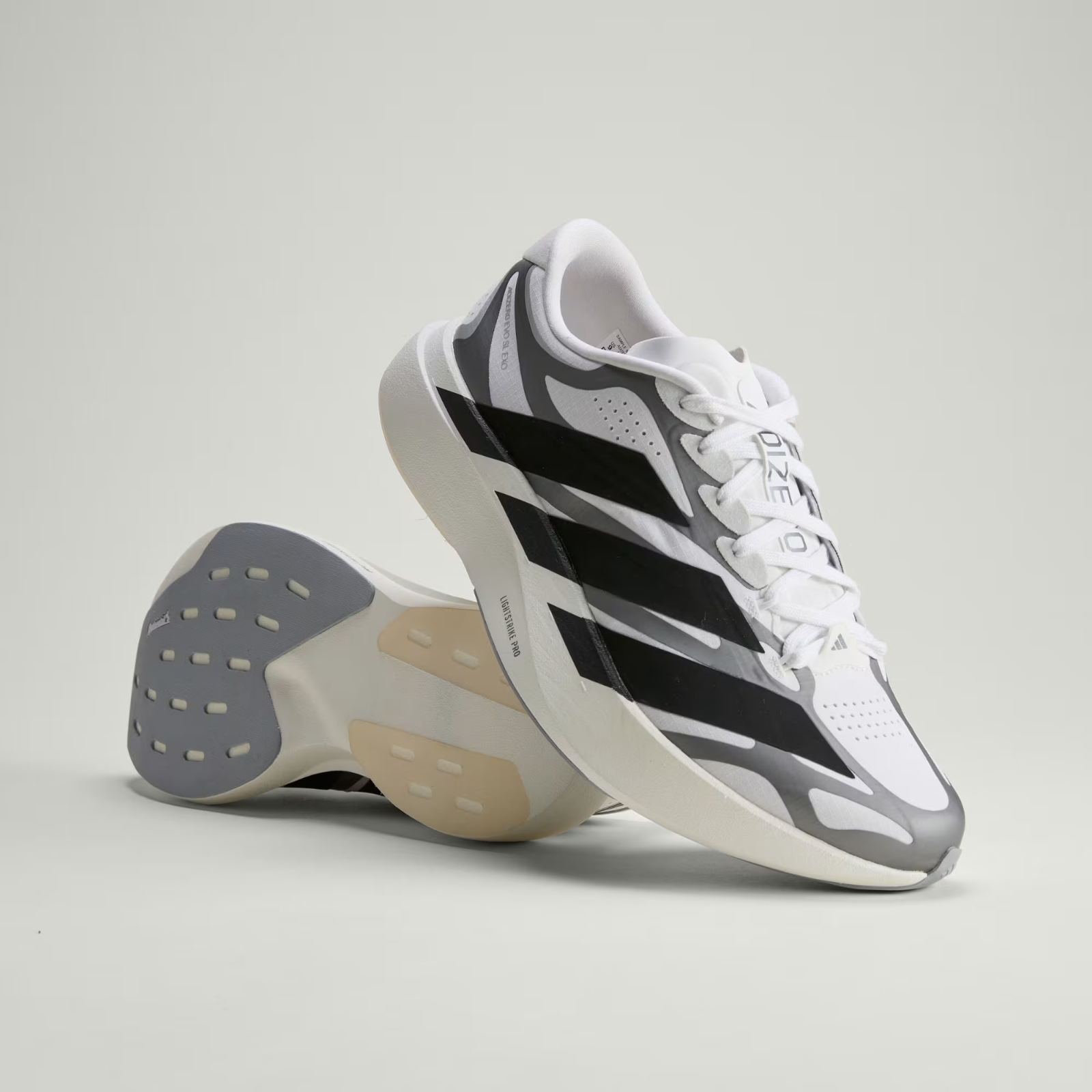 Adidas ADIZERO EVO SL EXO Shoes in Cloud White/Core Black/Iron Metallic