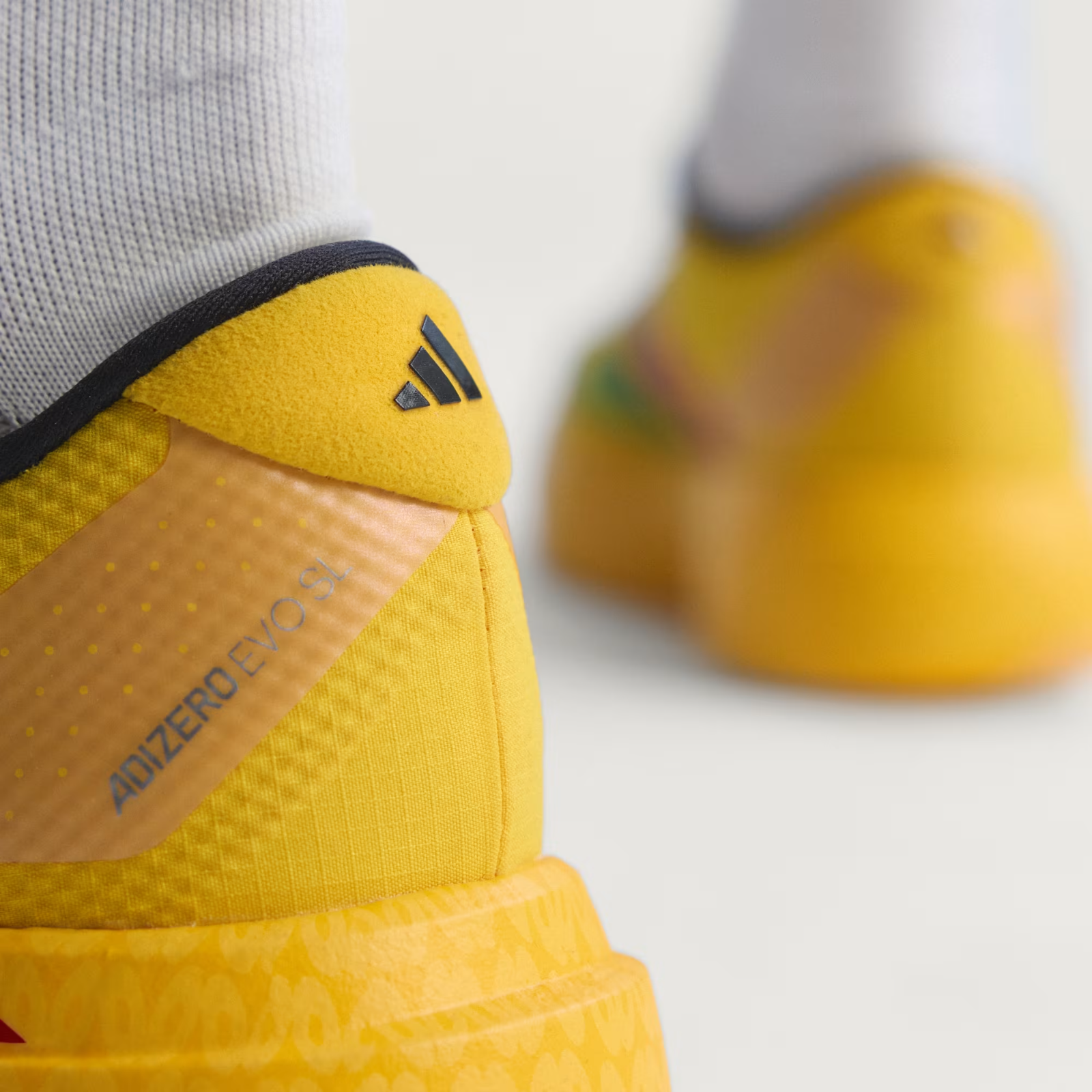 Adidas ADIZERO EVO SL Trainers in Bold Gold/Vivid Green/Pure Ruby Shoes