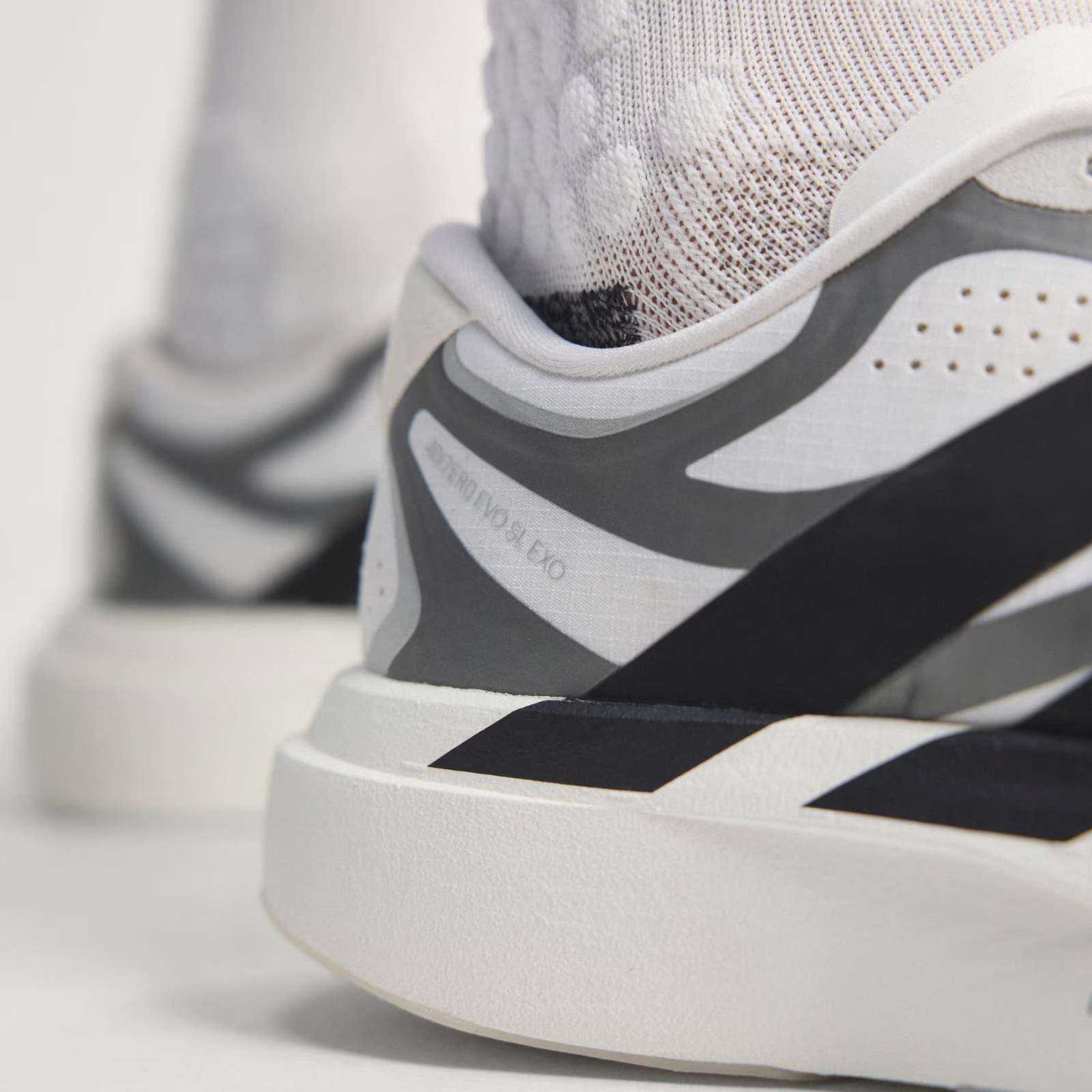 Adidas ADIZERO EVO SL EXO Shoes in Cloud White/Core Black/Iron Metallic