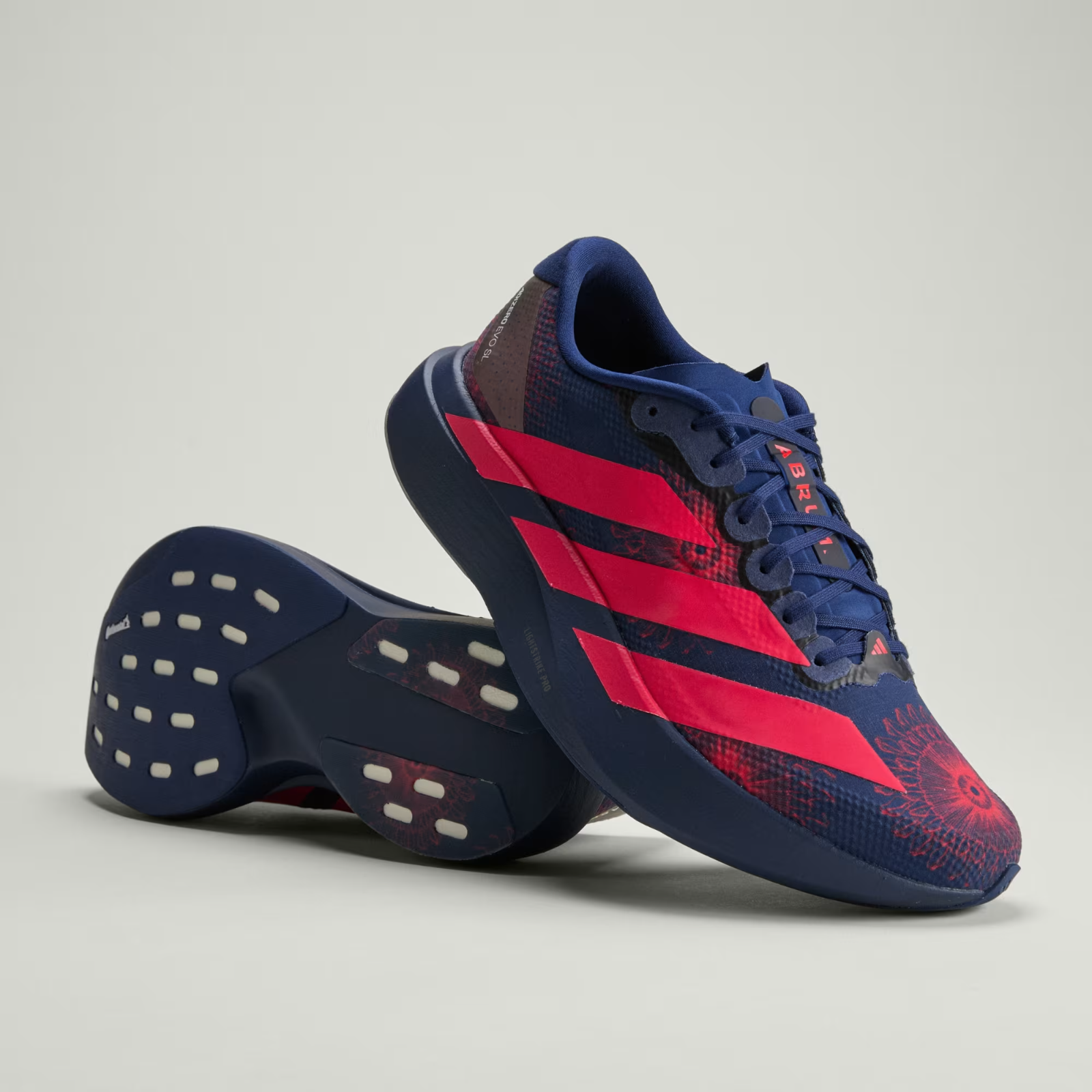 Adidas ADIZERO EVO SL Trainers in Dark Blue/Lucid Red/Muted Purple Shoes