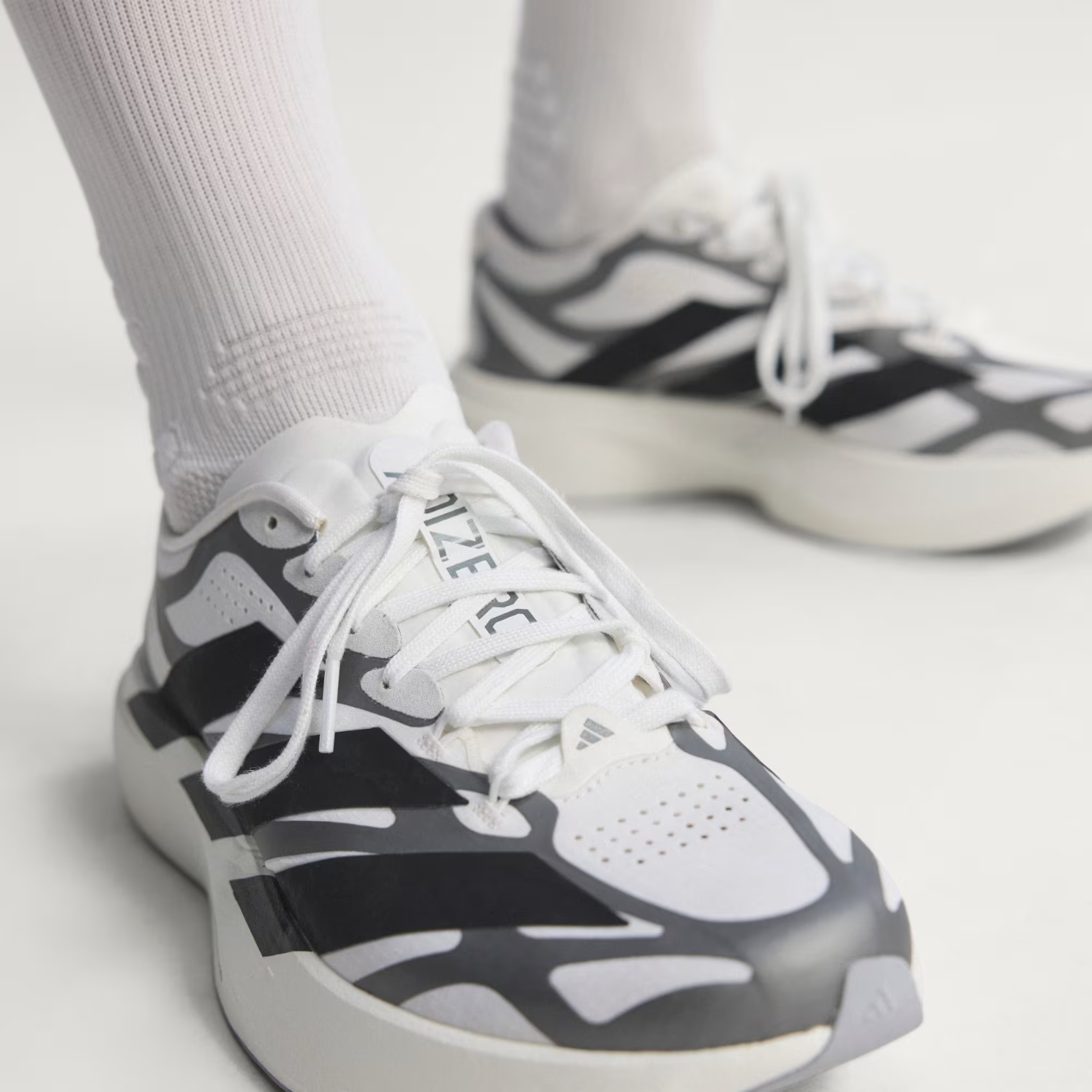 Adidas ADIZERO EVO SL EXO Shoes in Cloud White/Core Black/Iron Metallic